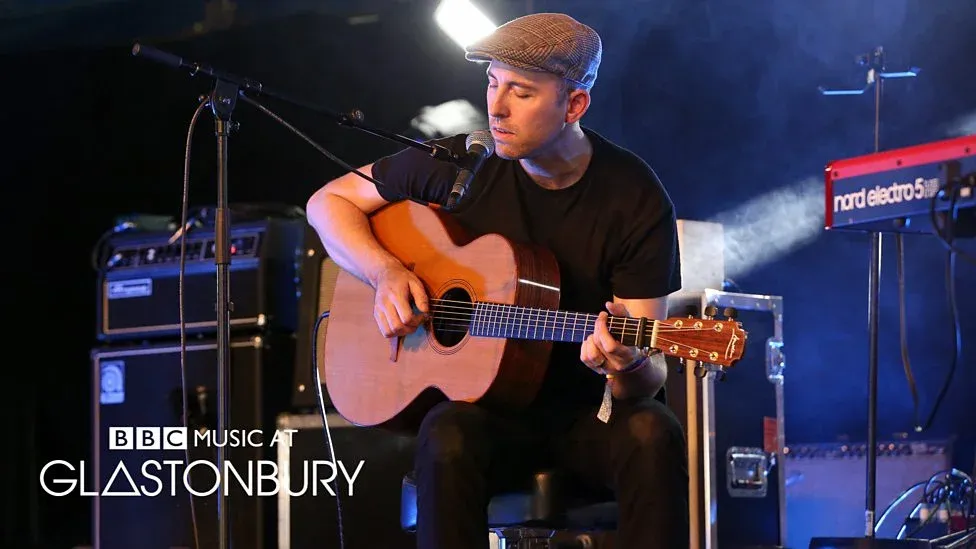 Connor McDonald playing acoustic guitar live at BBC Music at Glastonbury